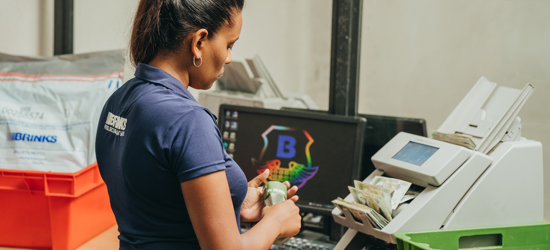 A woman sorting cash 